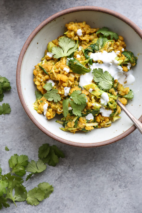 a healing cleansing ayruvedic kitchari recipe in a saucepan with vegetables - gluten-free, vegan, dairy-free