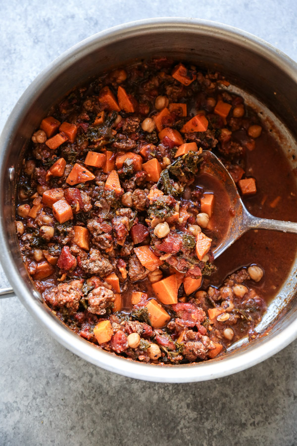 gluten-free lamb chili in a pot with a laddle