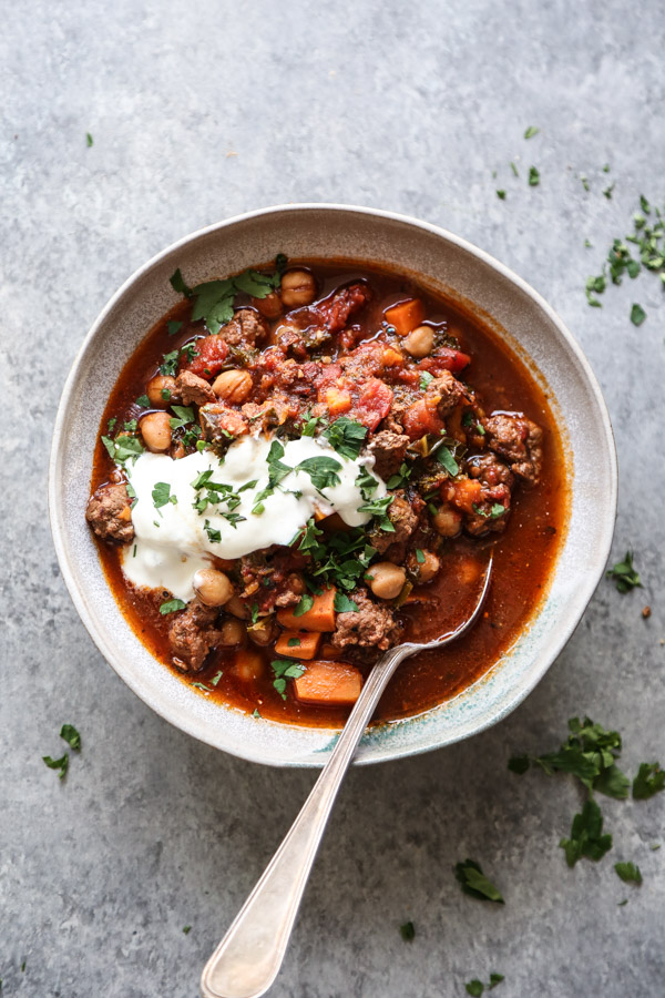 ground lamb chili in a bowl with a spoon
