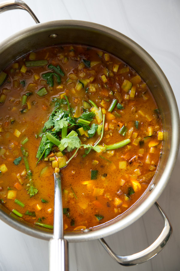 Summer Detox Soup in a pot with zucchini, summer squash and peppers