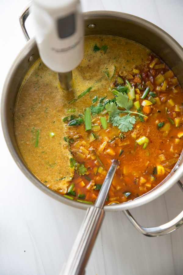 Summer Detox Soup in a pot with zucchini, summer squash and peppers
