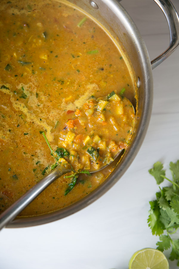 Summer Detox Soup in a pot with zucchini, summer squash and peppers