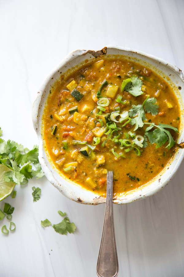 Summer Detox Soup in a bow with zucchini, summer squash and peppers