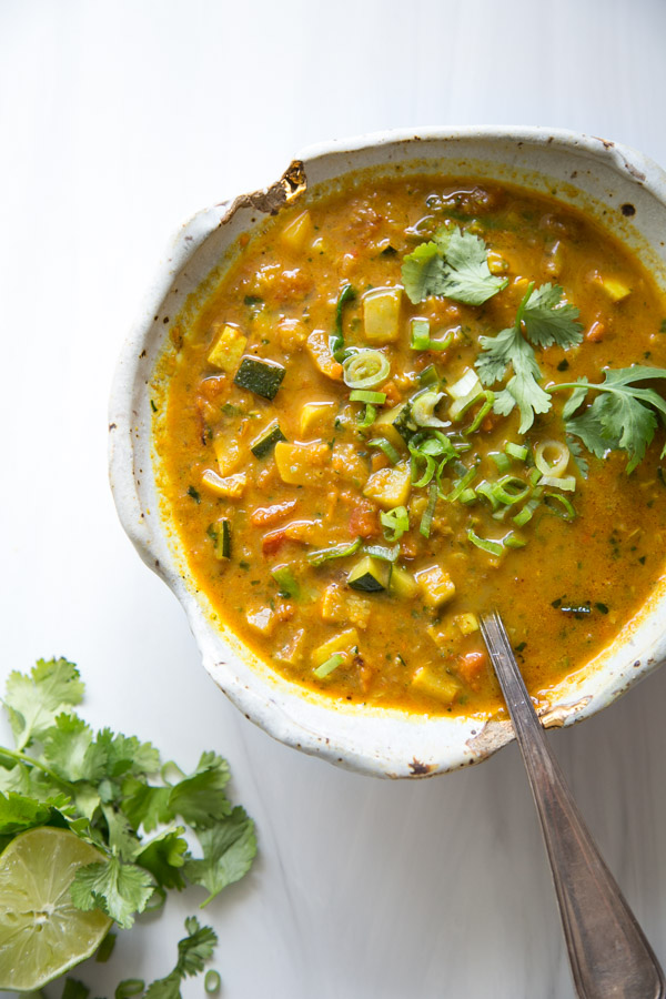 Summer Detox Soup in a bow with zucchini, summer squash and peppers